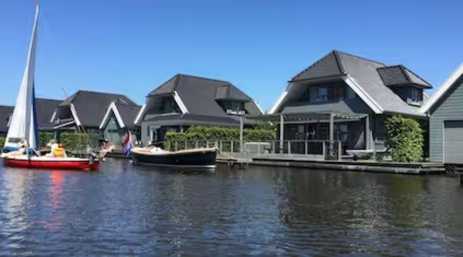 Luxurious holiday home with air conditioning, sauna, boats in private harbour in Lemmer