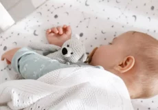 adorable-baby-with-toy-peacefull