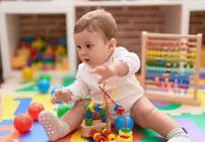 adorable-toddler-playing-with-to